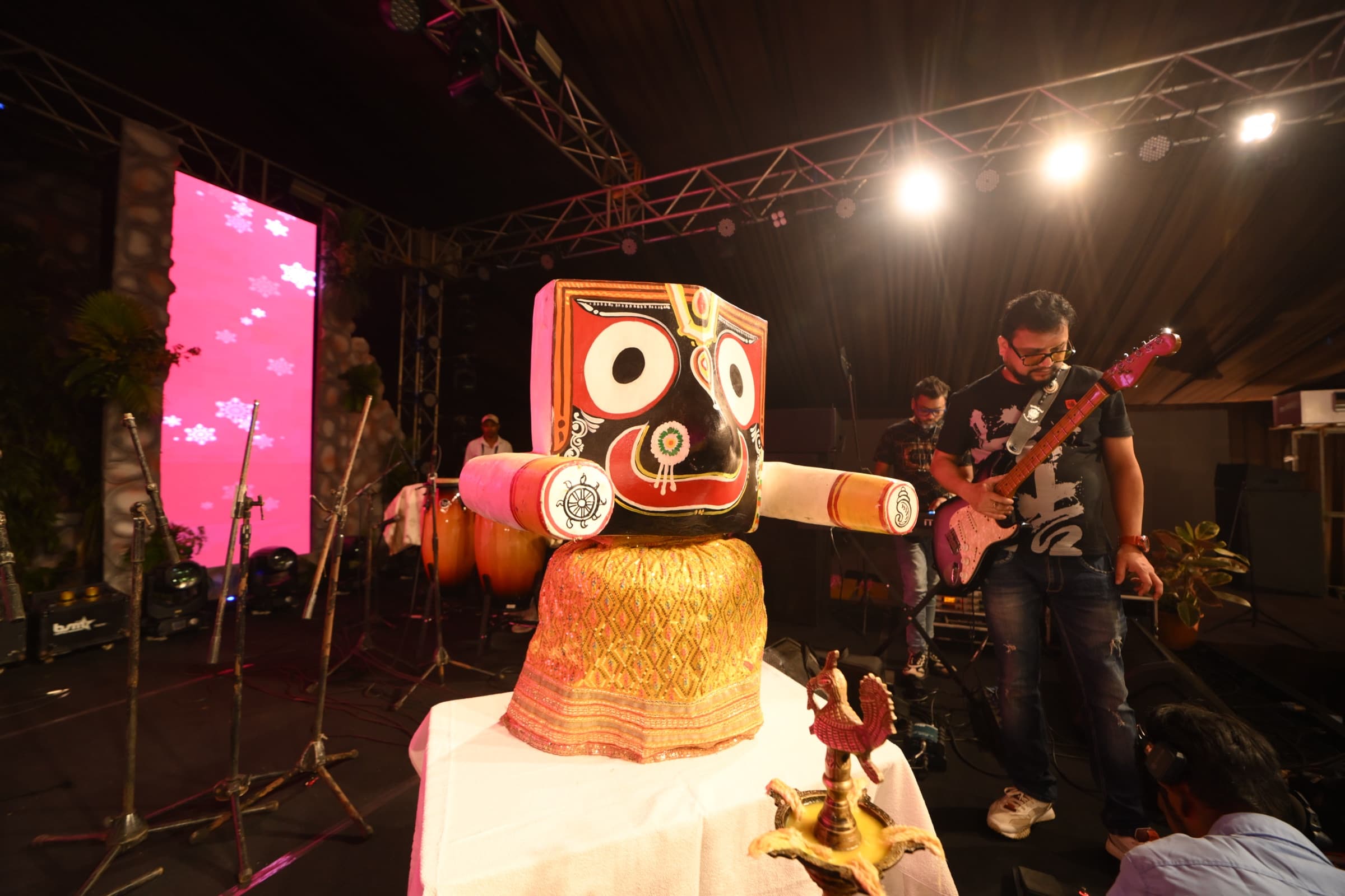 Live band performance alongside a traditional decorative centerpiece